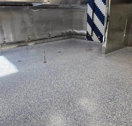 Coved urethane cement floor in a commercial kitchen